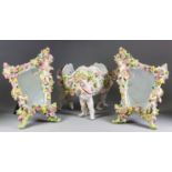 A Pair of German Porcelain Dressing Table Mirrors, Late 19th/Early 20th Century, the porcelain