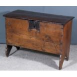 A 17th Century Plank Oak Coffer of Small Proportions, with carved edge to top and body, on shaped