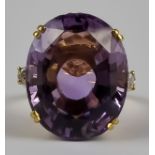 A Large Amethyst and Diamond Ring, Modern, in 18ct gold mount, set with a centre amethyst