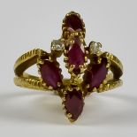 A Ruby and Diamond Cluster Ring, Modern, in 14ct gold mount, set with five faceted rubies,