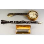 A Boosey & Hawkes "Regent" Blackwood and Plated Metal Mounted B-Flat Clarinet, 25.5ins overall and