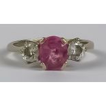 A Pink Sapphire and Diamond Three Stone Ring, Modern, in 18ct white gold mount, set with a centre