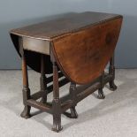 An 18th Century Mahogany Oval Gateleg Table, fitted one frieze drawer, on turned supports with