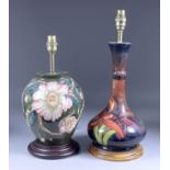 A Moorcroft Pottery Table Lamp with a full blown flower and leaf design, on turned wood base, 13.
