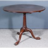 An Early George III "Cuban" Mahogany Circular Tripod Table, with solid one-piece top, on turned