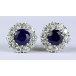 A Pair of Sapphire and Diamond Flower Head Earrings, Modern, for pierced ears, 18ct gold each set