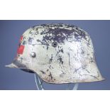 A Rare German World War II Waffen - SS Medics Helmet, the M42 painted white bearing red