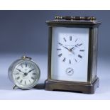 A Mid 20th Century English Brass Cased Carriage Clock, and an American Plated Metal Cased Timepiece,