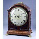 An Early 19th Century Mahogany and Brass Mounted Mantel Clock, the 8ins diameter domed painted metal