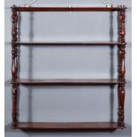 A Victorian Mahogany Four-Tier Wall Shelf, with slender turned uprights, 25ins wide x 6.5ins deep