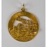 A 14ct Gold Circular Pendant, Modern, cast with San Francisco Golden Gate Bridge, city and