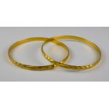 Two Gold Colour Metal Stiff Bangles, Modern, gross weight 24.9 Note: Metal unmarked but tests a 22ct