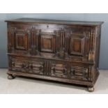 A Late 17th Century Panelled Oak Mule Chest, with plain lid, the front with triple raised and