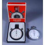 Two Heuer Stop Watches, one in chrome case, the white dial with Arabic numerals, 56mm diameter,