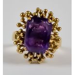 An Amethyst Dress Ring, Modern, in 18ct gold mount, set with a faceted amethyst stone, approximately