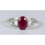 A Ruby and Diamond Ring, Modern, in 18ct white gold mount, set with a centre faceted ruby