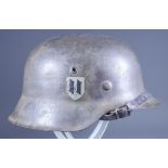 A German World War II SS Helmet, the M42 style steel helmet in green bearing Croatian SS Runes