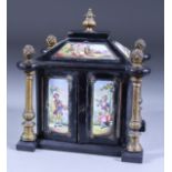 A Continental Ebonised Miniature Cabinet with Eight Applied Enamel Plaques to the Exterior, Late