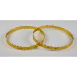 Two Gold Colour Metal Stiff Bangles, Modern, gross weight 23g Note: Metal unmarked but tests as 22ct