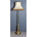 A Victorian Brass Adjustable Electric Standard Lamp, with fluted column, three scroll supports to