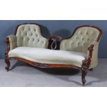 A Victorian Rosewood Framed Twin Chair Back Settee, with moulded showwood frame, upholstered in