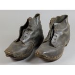 A Pair of English Clogs, Early 20th Century, with wood soles, leather uppers and cockers to