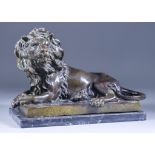 After A. L. Barye (1796-1875) - Bronze figure of a recumbent lion on rectangular base, signed, on
