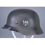 A German World War II Helmet, painted, with double decals