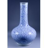 A Chinese Blue and White Bottle Vase, 19th Century, painted with trailing leaves and flowers,