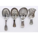 A George III Silver Caddy Spoon and Three Other Silver Caddy Spoons, the George III spoon, by John