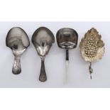 Four George III Silver Caddy Spoons, one cast silver gilt vine and fruiting leaf pattern spoon,