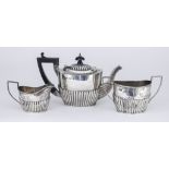 A Late Victorian/Edwardian Bachelors Silver Oval Three-Piece Tea Service, by George Unite,