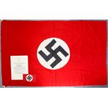 A German 1942 Large Award Document with Arm Band, a German World War II flag, 59ins x 37ins, and a