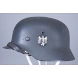 A German World War II Helmet, painted, with double decals