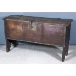 A Late 17th Century Plank Oak Coffer, with oxidised metal oak leaf pattern strap hinges and chip