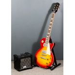 An Epiphone Les Paul Standard Pro Electric Guitar, Serial No. 13112304753, and a Roland Micro Cube