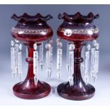 A Pair of Ruby Glass Lustre Vases, Late 19th Century, with crimped rims and hung with clear glass