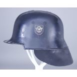 A German World War II Fire Service Helmet, painted black, double decal with leather neck guard
