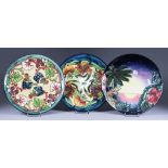 A Limited Edition Moorcroft Pottery Year Plate for 1998, No. 567 of 750, another for 1999, No. 352