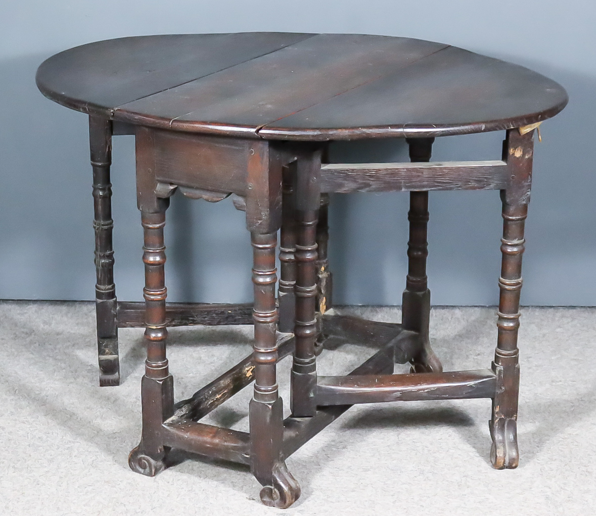 A Late 17th/Early 18th Century Oak Oval Gateleg Table of Small Proportions, on turned supports