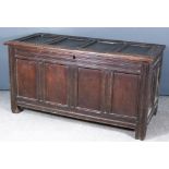 A 17th Century Panelled Oak Coffer, with four panel lid and front, the whole with moulded rails,