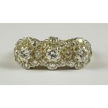 A Diamond Triple Flower Head Ring, 20th Century, 18ct gold, set with brilliant cut white diamonds,