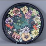 A Limited Edition Moorcroft Pottery Charger, with "Carousel" design by Rachel Bishop, No. 694,