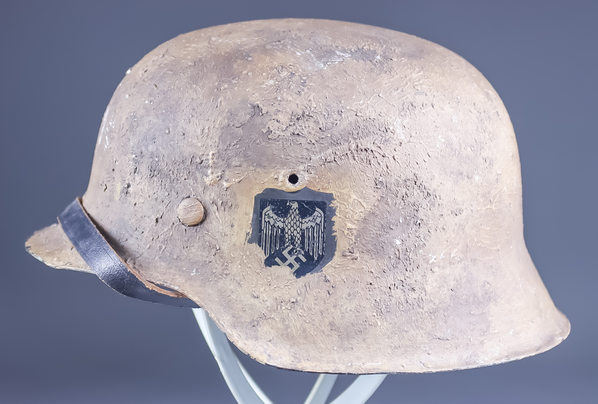 A German World War II M$" Desert/Tropical Camo Helmet, in all over painted beige, bearing Heer Eagle