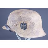 A German World War II M$" Desert/Tropical Camo Helmet, in all over painted beige, bearing Heer Eagle