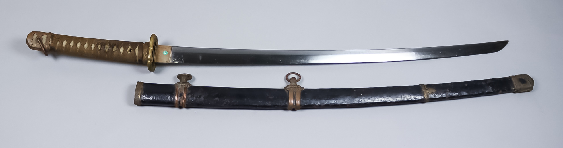 A World War II Japanese Katana, Showato military mounts, signed and dated 9th month 16years of Showa