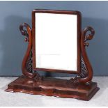 A Victorian Mahogany Framed Rectangular Toilet Mirror, on carved swan pattern uprights, the platform