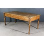 A Late Victorian Pine Kitchen Table, with four-plank top and plain apron, on turned legs, 35ins x