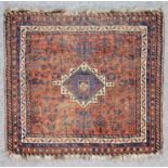 A Late 19th/Early 20th Century Persian Juval woven in colours of navy blue, ivory and terracotta,