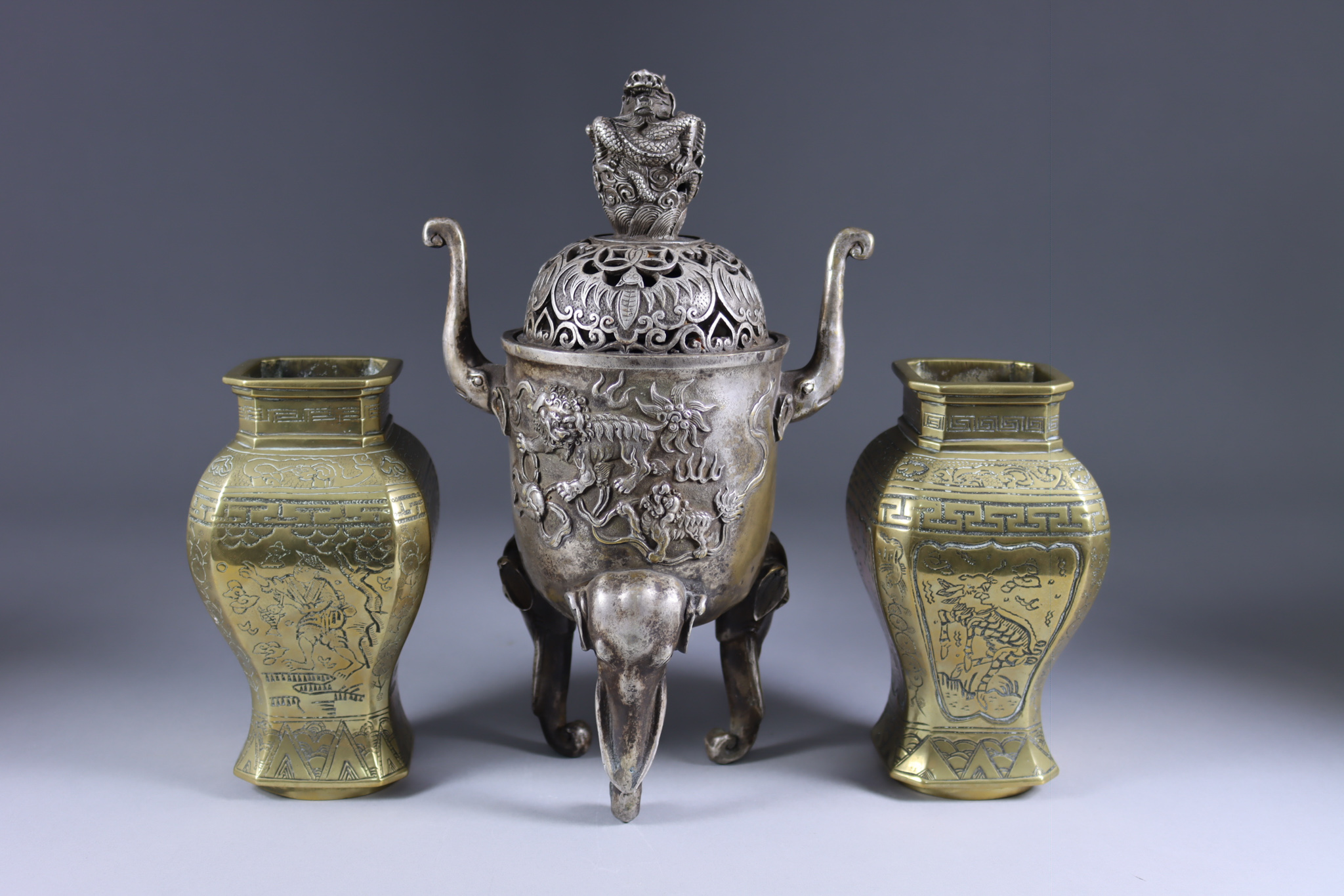 A Chinese Silvered Bronze Two-Handled Censer and Cover, 19th/20th Century, the body cast with